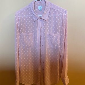 Pretty pink color with gold buttons. Love this shirt but too big